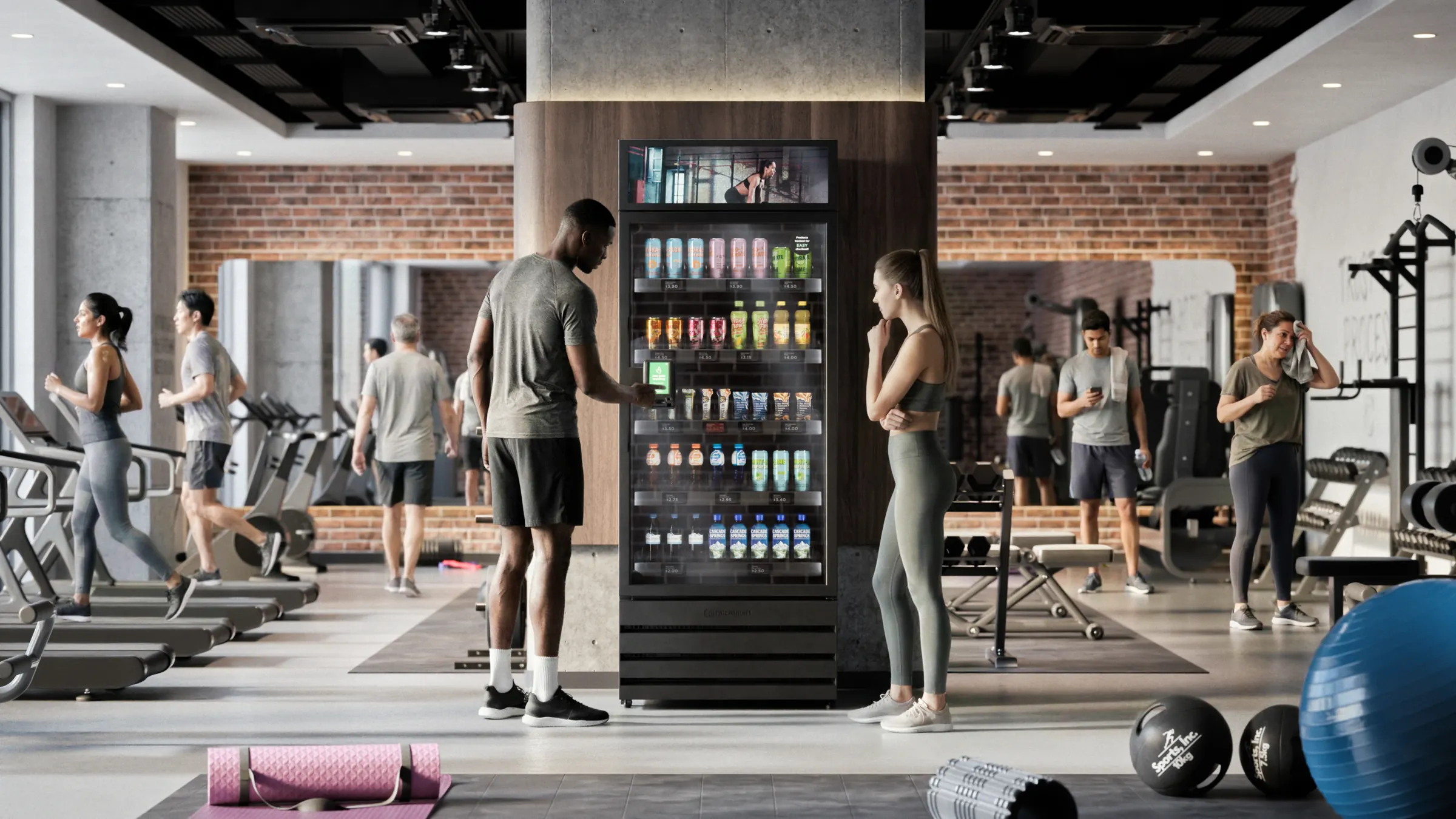 A smart cooler on a gym floor, someone tapping to open it between sets.
